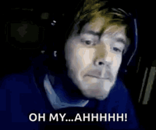 a man wearing headphones is making a funny face and saying oh my ... ahhhh !