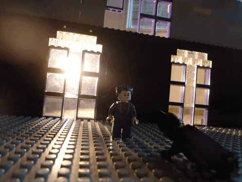 a lego man standing in front of a building