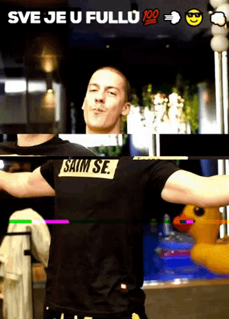 a man wearing a black shirt that says saim se on it