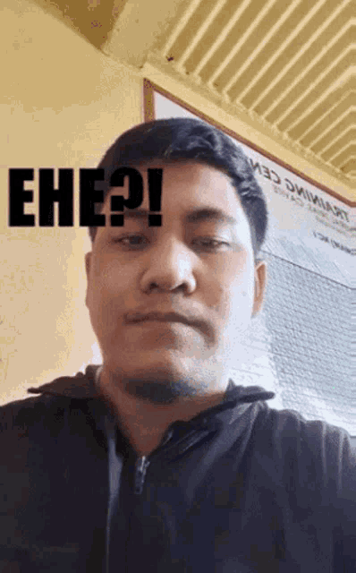 a man with the word eh ? on his face