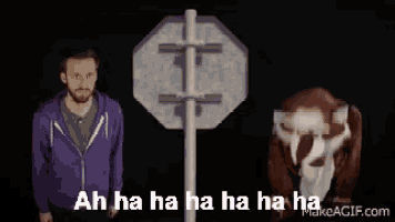 a man in a purple hoodie stands next to a raccoon mascot and says ah ha ha ha ha ha ha