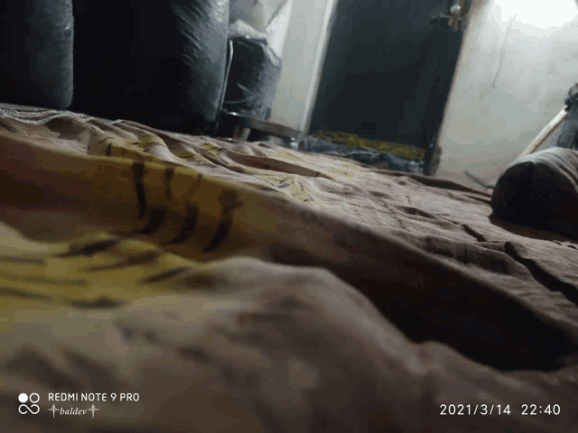 a redmi note 9 pro takes a picture of a blanket