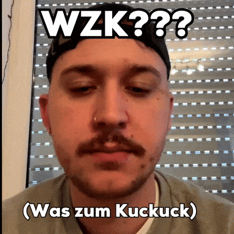 a man with a beard is wearing a hat with the words wzk written on it