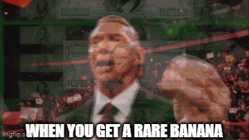 a man in a suit and tie is holding a banana in front of a crowd with the words " when you get a rare banana "