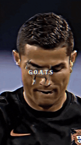a close up of a man 's face with the words goats on it
