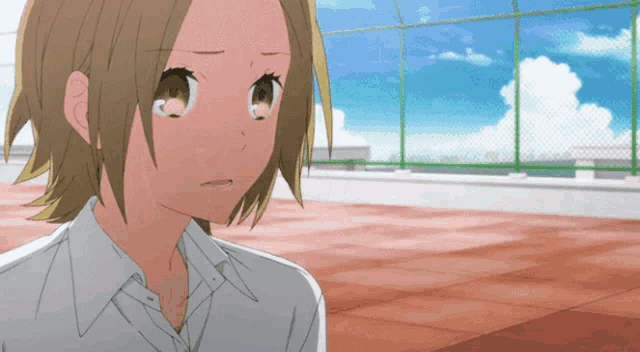 a girl in a white shirt has a tear running down her face