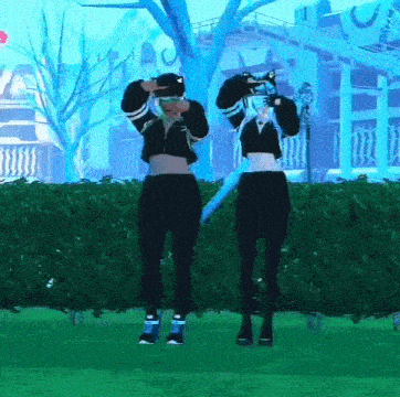 a couple of girls are standing next to each other in a park wearing virtual reality headsets .