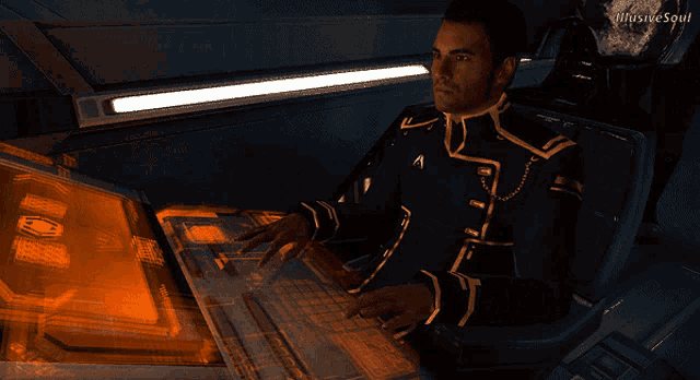 a man sitting in front of a computer with illusive soul written on the bottom right corner