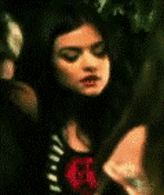 a close up of a woman 's face in a blurry photo .