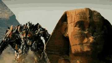 a statue of a man standing next to a transformer