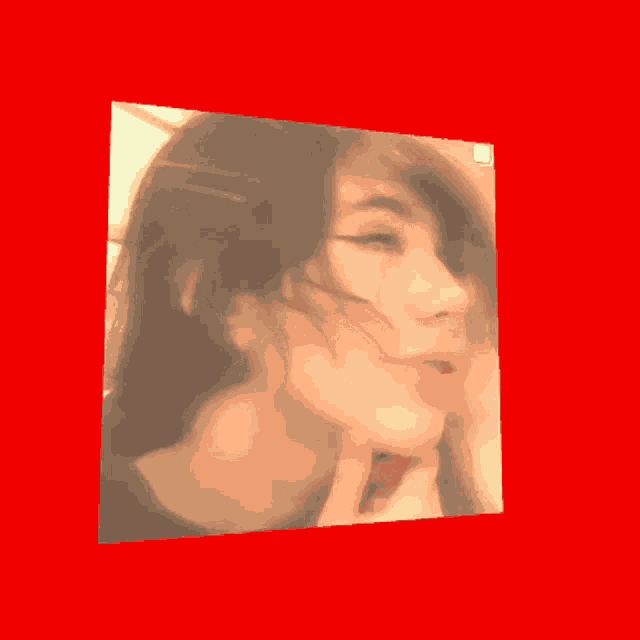 a picture of a woman 's face is against a red background