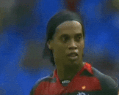 a soccer player wearing a black hat and a red and black jersey with the letter cr on it
