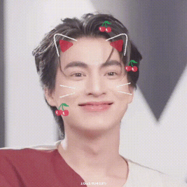 a close up of a person 's face with a cat ear and cherry on it .