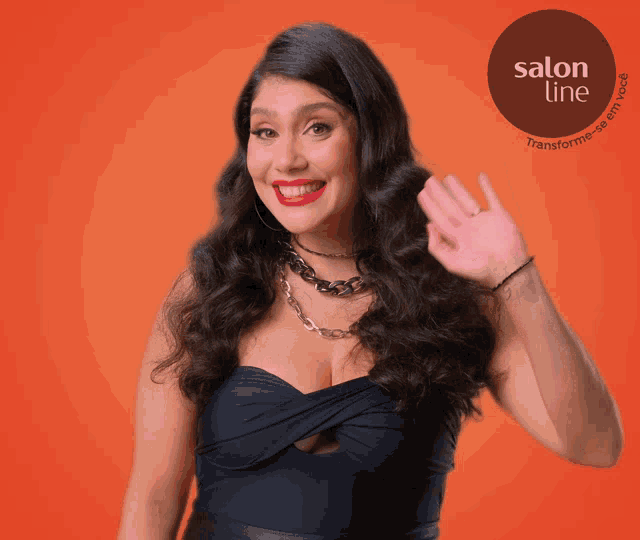 a woman is waving in front of a salon line advertisement
