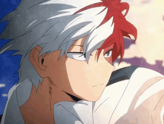 a close up of a cartoon character with red and white hair