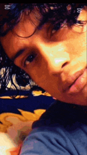 a close up of a person 's face with a watermark that says ' x ' on it
