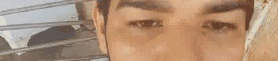 a close up of a man 's eyes with a blurred background .