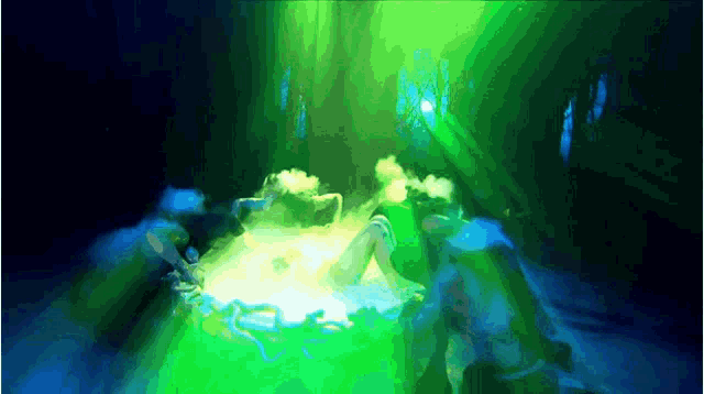 a green light is shining on a person 's head