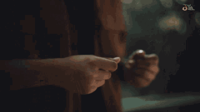 a blurry photo of a person 's hands with the word jazz on the bottom right