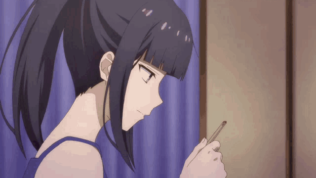 a girl in a ponytail is holding a pen in her hand