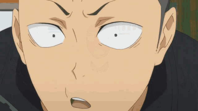a close up of a person 's face with a serious look on his face