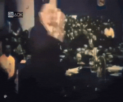 a blurred image of a crowd with the letters 24 aok on the bottom right