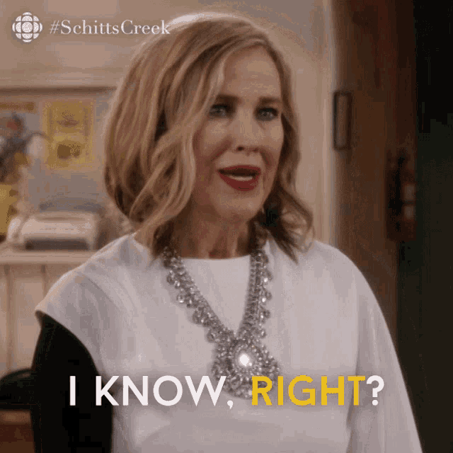 a woman wearing a necklace and a white shirt says " i know right "