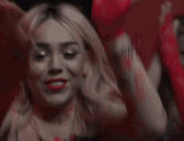 a woman with a tattoo on her arm that says ' i love you '