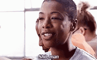 a woman with a shaved head is smiling and says `` shit man '' .
