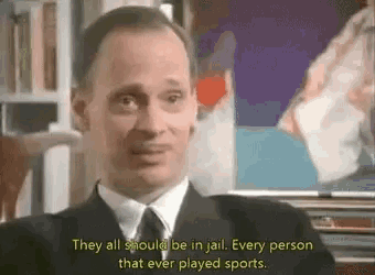a man in a suit and tie says they all should be in jail every person that ever played sports .