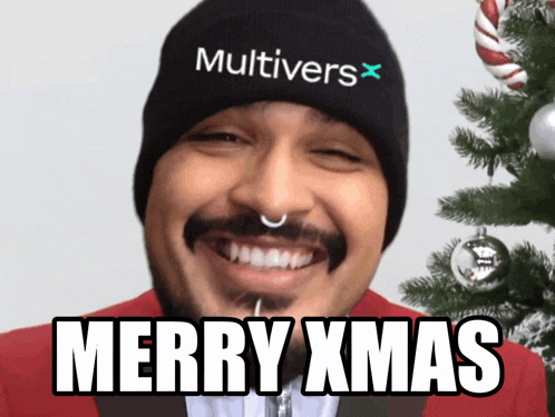 a man wearing a beanie that says multivers x on it