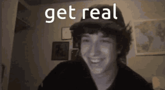 a young man wearing a hat is smiling with the words get real above him