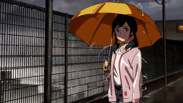 a girl in a pink jacket holding a yellow umbrella in the rain