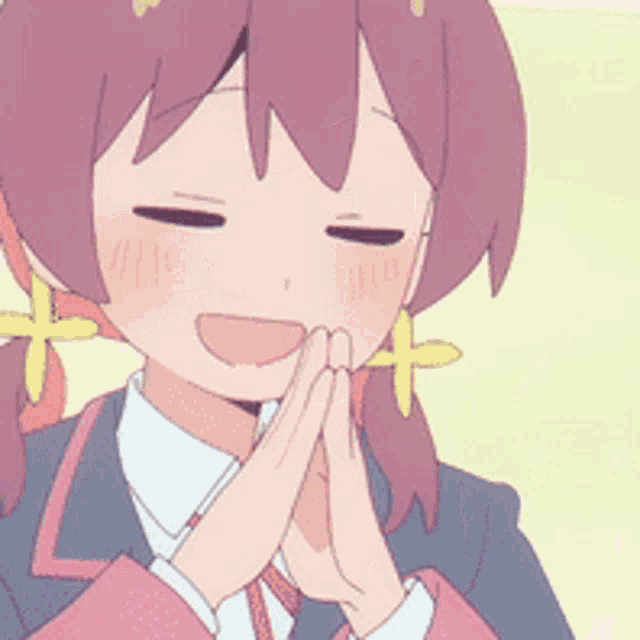 a girl with pink hair is smiling with her eyes closed and her hands folded