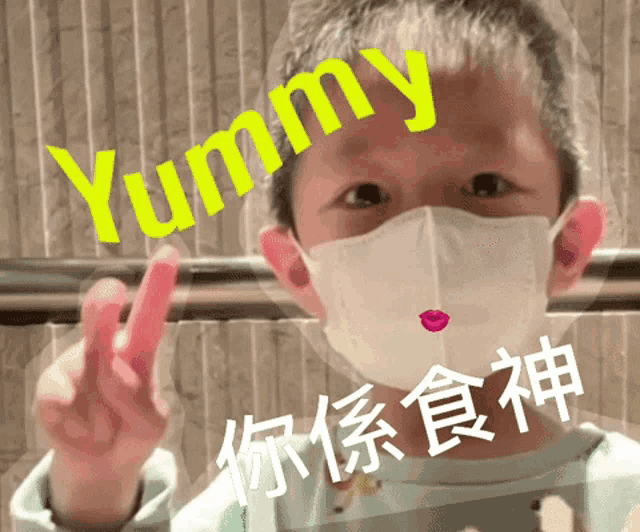 a child wearing a mask with the word yummy written on his face