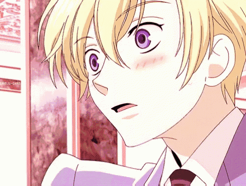 a close up of a boy with purple eyes