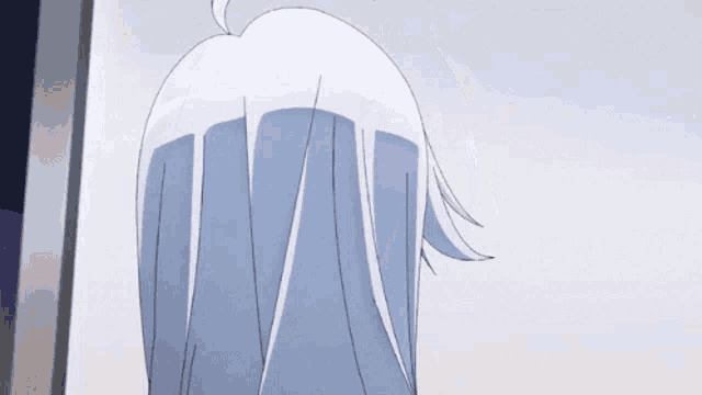 a close up of a person 's hair with a gray background