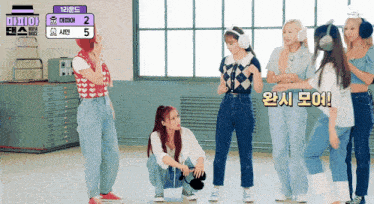 a group of girls wearing headphones are standing in front of a sign that says maya dance