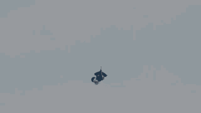 a person is falling from a parachute that says red bull