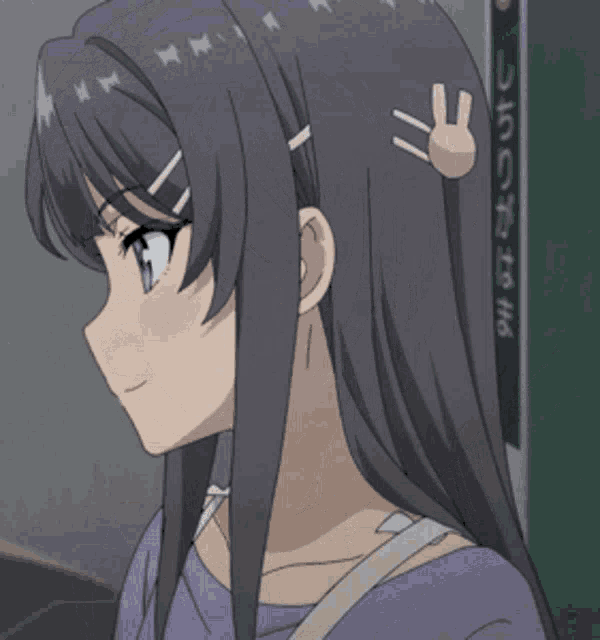 a girl with purple eyes is holding a piece of paper in her hand .