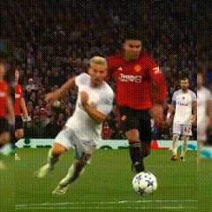 a soccer player wearing a red jersey that says teame