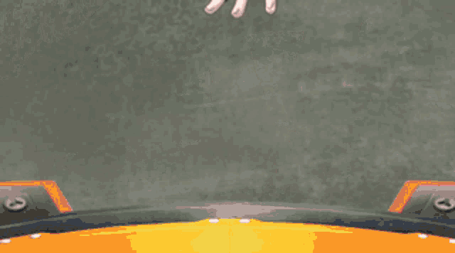 a person wearing a red glove with white fingers