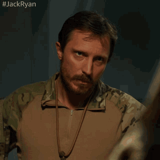 a man with a beard says who in a military uniform