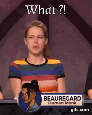 a woman is sitting at a table with a sign that says beauregard human monk on it .