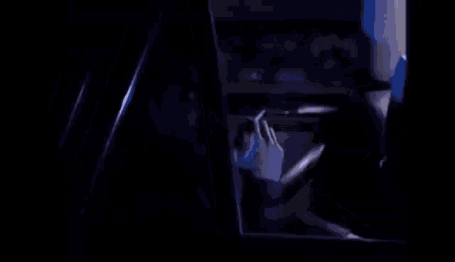 a man is smoking a cigarette in a car .