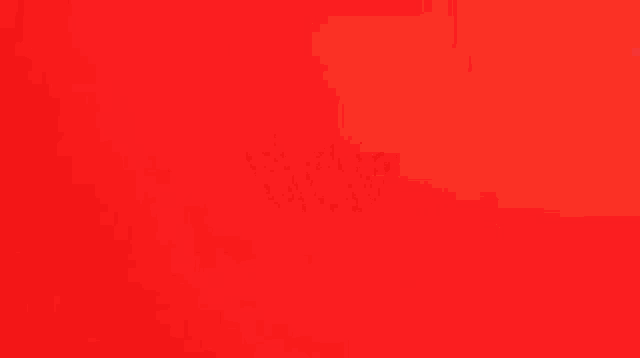 a red background with a yellow , blue , and purple object with eyes .