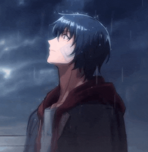 a boy with a bandage on his face looks up at the sky in the rain