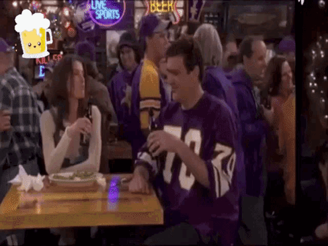 a man wearing a purple jersey with the number 73 on it