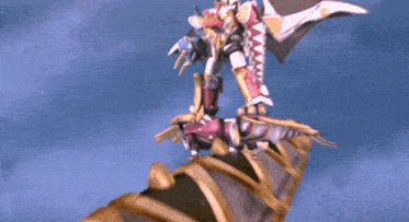 a cartoon character is flying over a very tall object with a blue sky in the background
