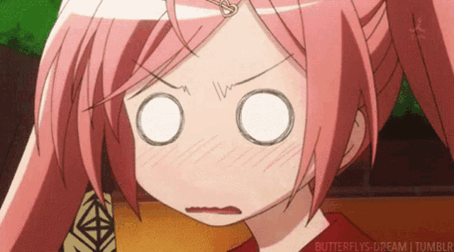 a girl with pink hair is making a funny face